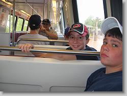Joshua and Mark on train to game.