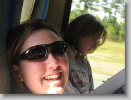 Taylor's having fun on the ride while Megan reads her educational novel.