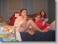 Kathryn (hiding), Gracen (thinking), Meredith (trying to be cool), and Hannah (the almost normal one) in our bedroom before bed.