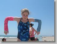 Meredith doing the robot on the beach.