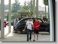 Glenn Guy and Joshua checking a vintage car.
