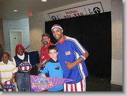 Joshua and 'High-Time' at the Harlem Globetrotters - March, 2008