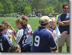 Coach handing in the medals.
