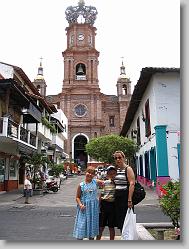 Ciara, Joshua and Aliza dowtown in front of the church.