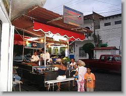 Sidewalk vendor - bar and grilled foods.