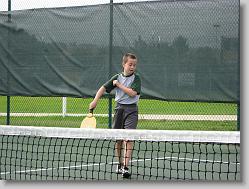 Joshua playing pickle ball with Ciara