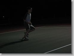 Soccer tennis at night.