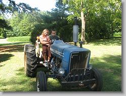 Ciara and Joshua on the tractor, at Glen's house.