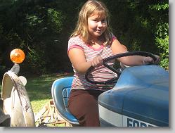 Ciara posing on the tractor.