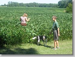 Ciara and Joshua in the field on the farm.