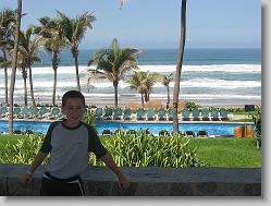 Joshua by the pool and oceanfront.